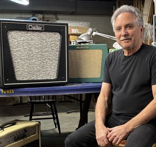 Mitch Colby poses with an original Elpico AC55 combo (center) and his Colby Elpico AC55 1x12 combo.