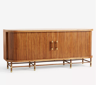 A wooden credenza with gold handles