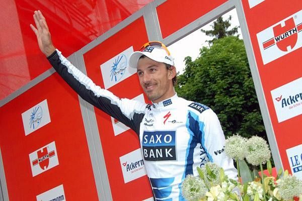 Cancellara waves to the crowd as he steps to the podium.