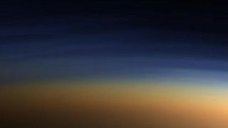 Titan has a brown-ish atmosphere of nitrogen and methane. Credit: ESA