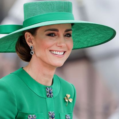 Kate Middleton in green dress and hat and sapphire and diamond earrings at Trooping the Colour