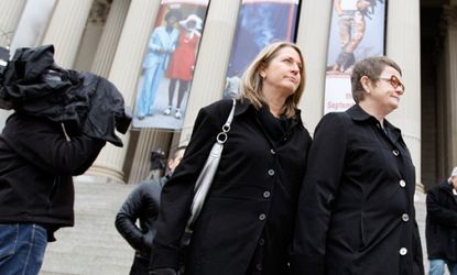 The couple at the center of the same-sex marriage case, Sandy Stier and Kris Perry, arrive at the Supreme Court on March 25.