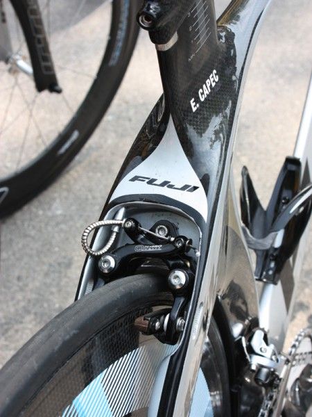 The rear brake is shielded within a radically shaped seat stay assembly but the tight confines require some rather convoluted cable routing.