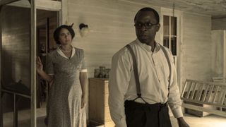 Parisa Fitz-Henley and Gbenga Akinnagbe as Louise and Earl Little on the porch in Genius: MLK/X