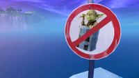 An image showing Yoda in a backpack superimposed onto a "no default dancing" sign in Fortnite.