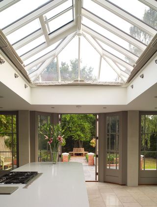 a kitchen with a large roof lantern