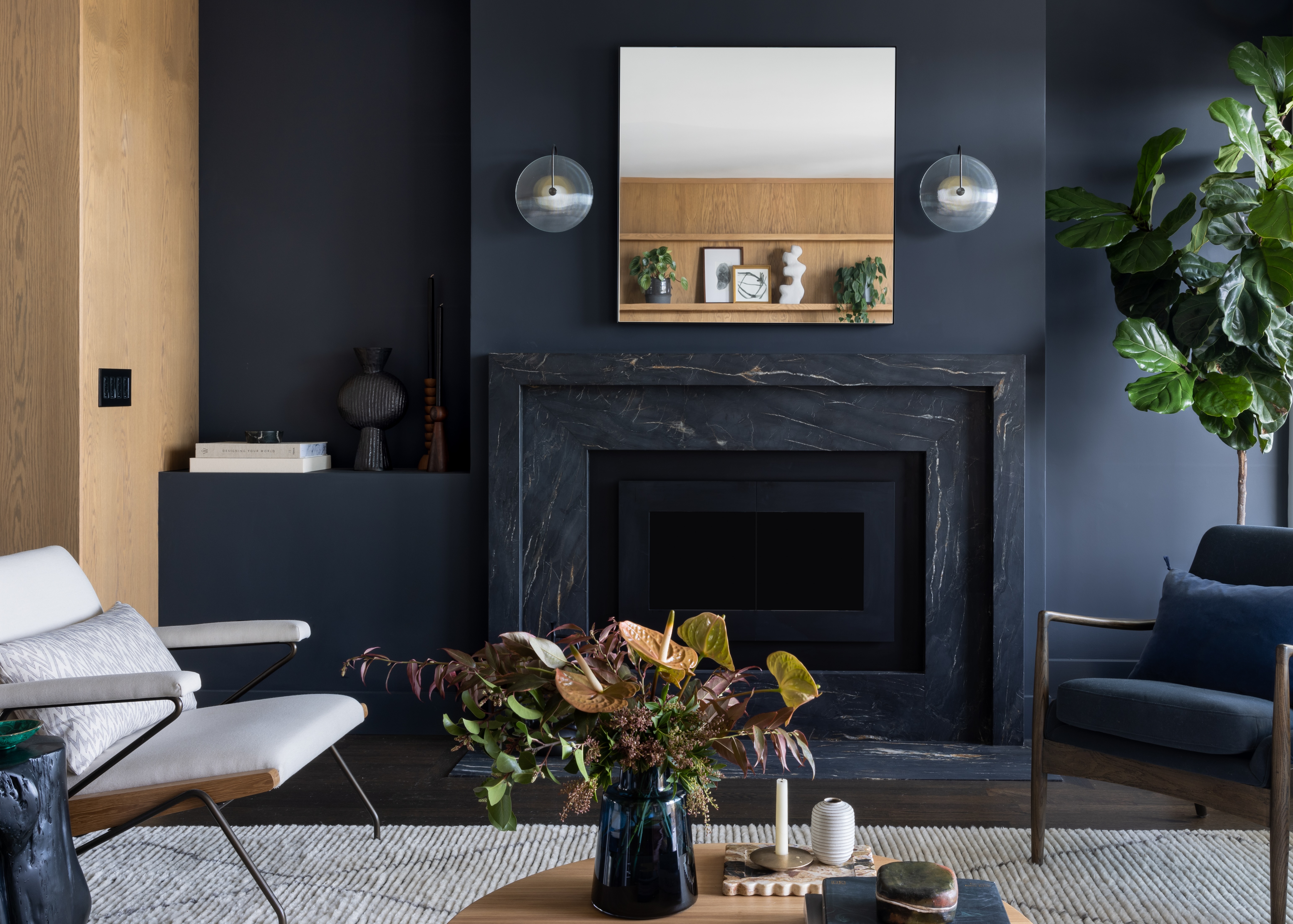 A contemporary living room painted in a charcoal shade