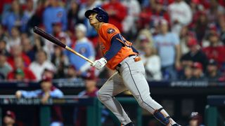 The Astros' Jeremy Pena watches a home run he hit soar in an MLB Playoffs live stream
