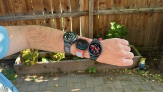Three smartwatches worn on one wrist for a step-counting accuracy test.