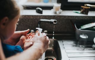 What is a hypochondriac? A woman washing her baby's hands