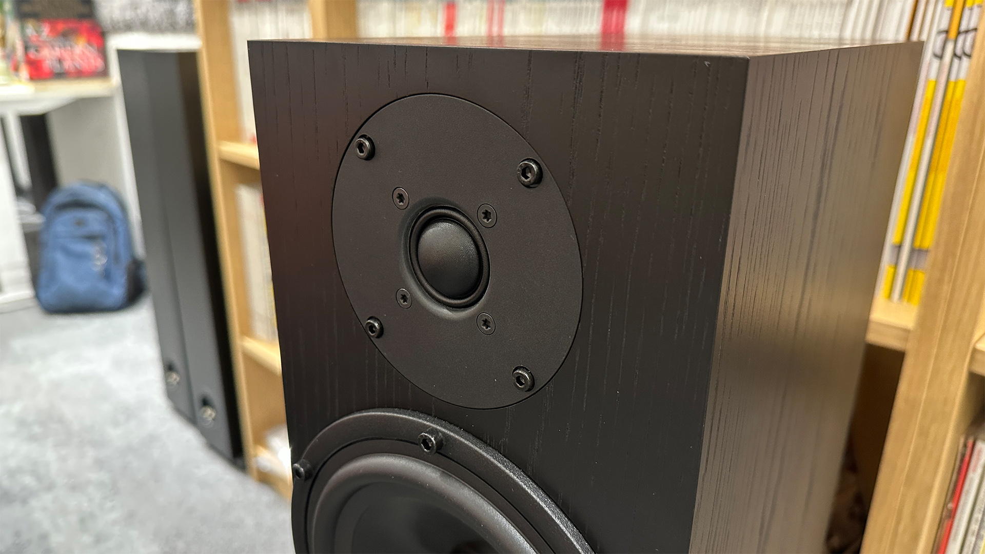 Spendor A7.2 floorstanding speakers in front of bookcase close up on tweeter