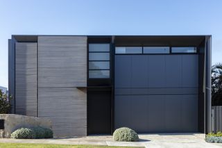 Modern home frontage with driveway and simple planting