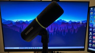 A Shure MV6 review image of the mic in front of a gaming monitor