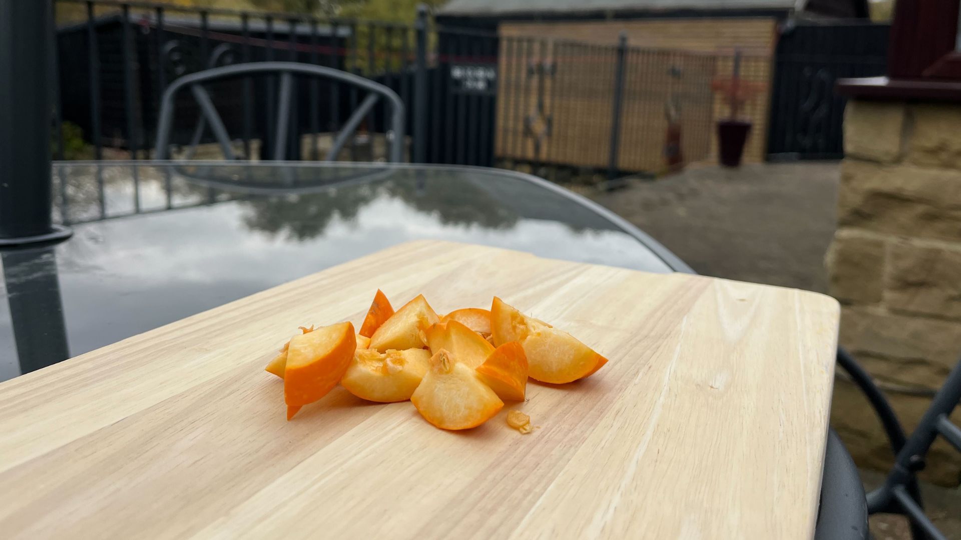 picture of diced pumpkin on chopping board outside