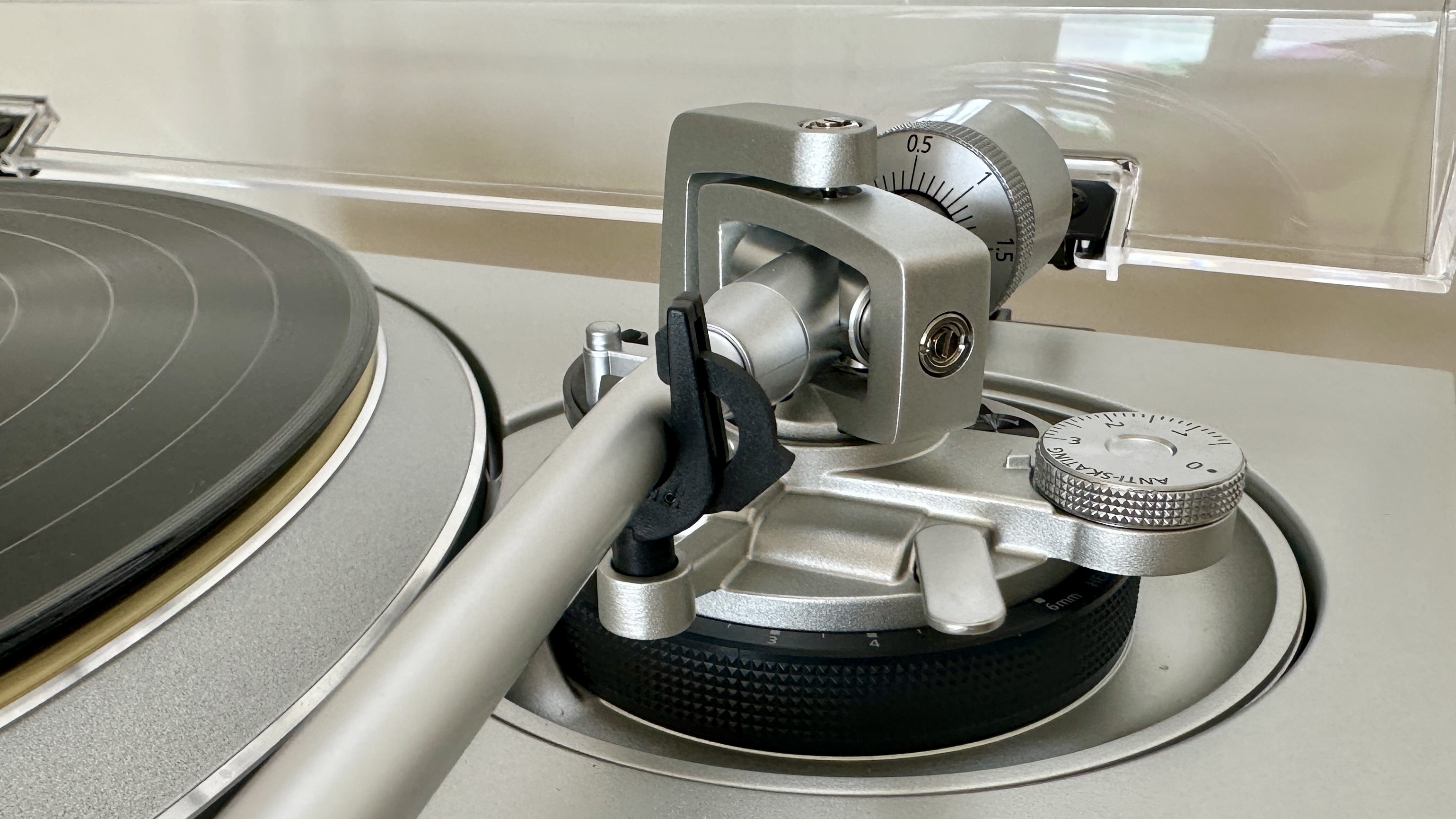 Tonearm of the Technics SL-1300G turntable.