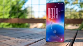 The default blue and red lockscreen Oxygen OS 16 wallpaper on a OnePlus 13