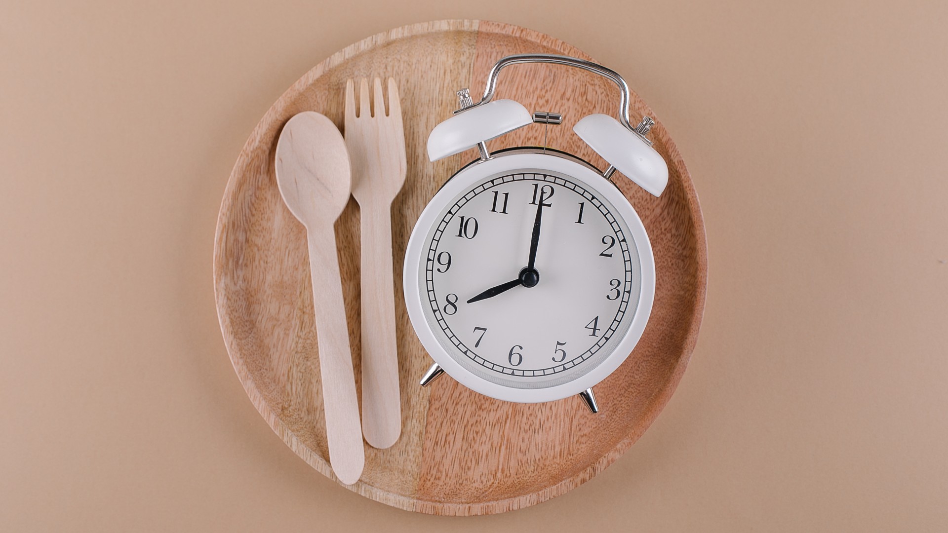 Image of clock and wooden knife and fork