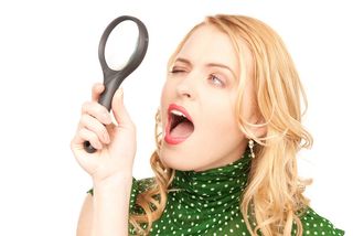 woman holding a magnifying glass