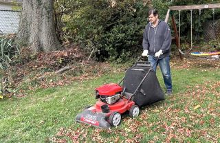 Man using a lawn vacuum