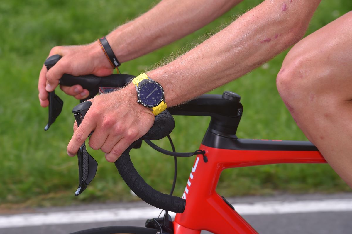 Stefan Kung with a co-ordinataded yellow Tag Heuer watch band