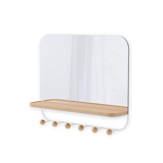 A mirror with a wooden shelf and hooks on it