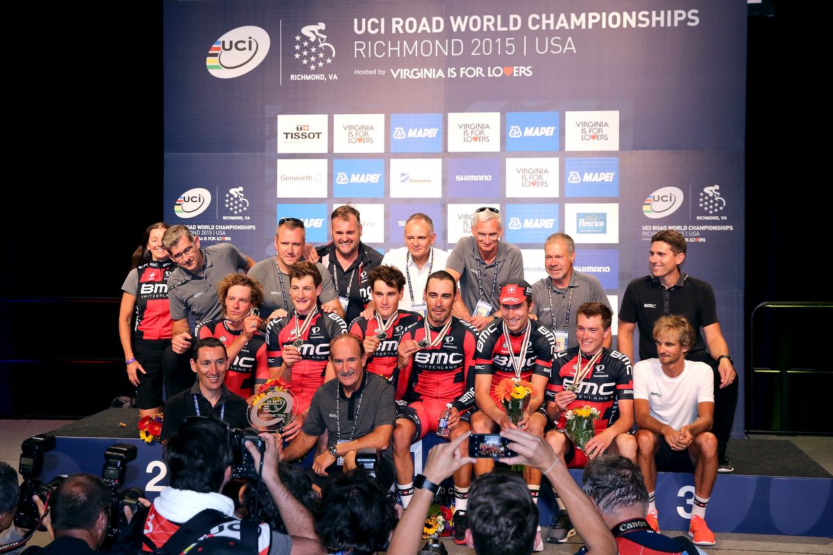 The entire BMC team and staff on the podium after the defence of its team time trial title