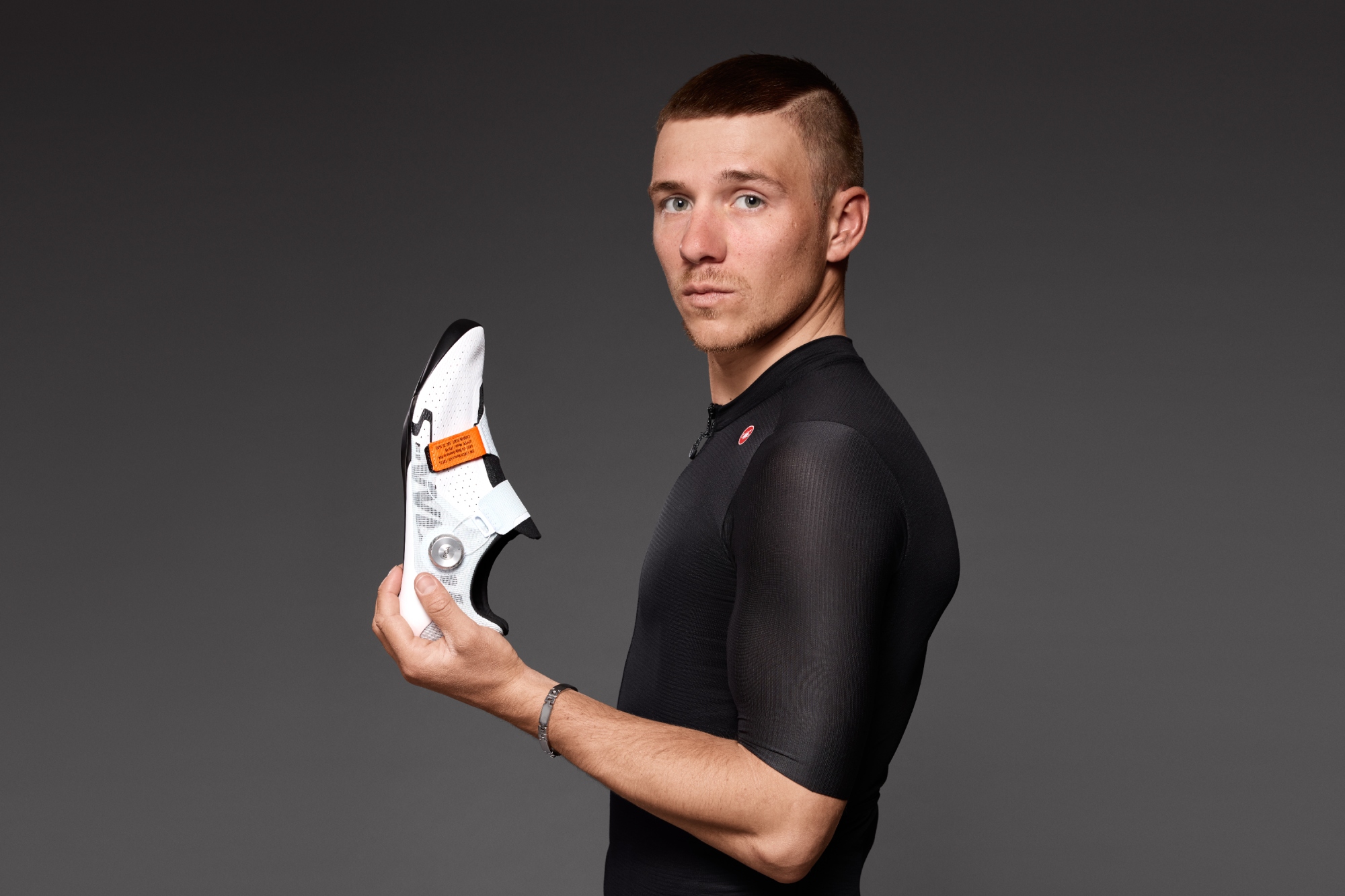 Remco Evenepoel holding 'his' Specialized S-Works Torch Remco shoe