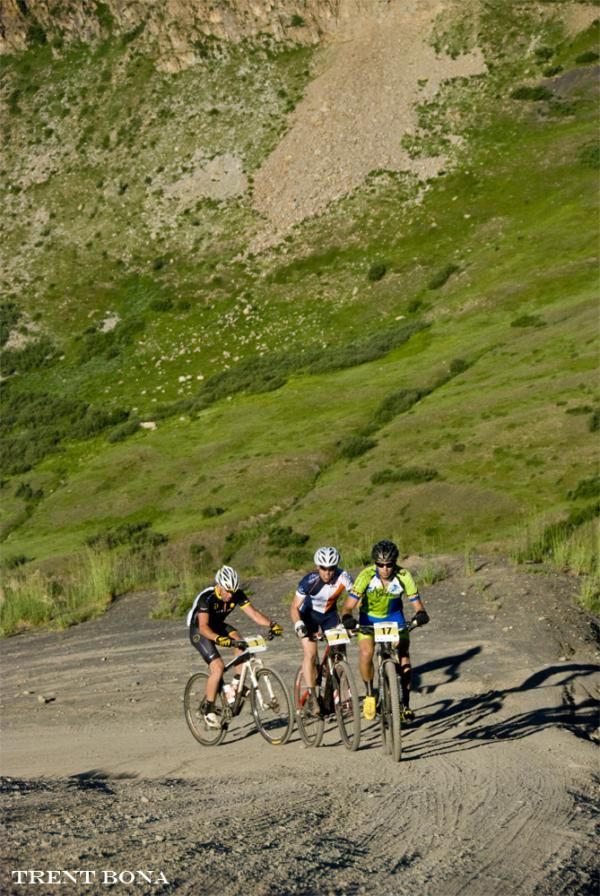 Travis Scheefer, Cameron Brenneman &amp; Lance Armstrong round the corner