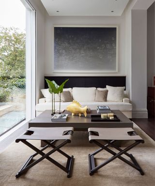 Brown living room with white walls and artwork