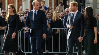 Prince William and Catherine, Princess of Wales accompanied by Prince Harry and Meghan, the Duke and Duchess of Sussex, proceed to greet well-wishers outside Windsor Castle