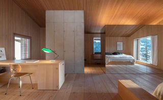 Study room with wooden floor and walls