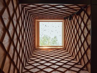 Looking up through wood-clad lightwell