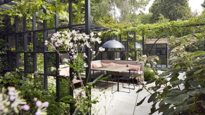 A contemporary town garden zoned with decorative crittal screens