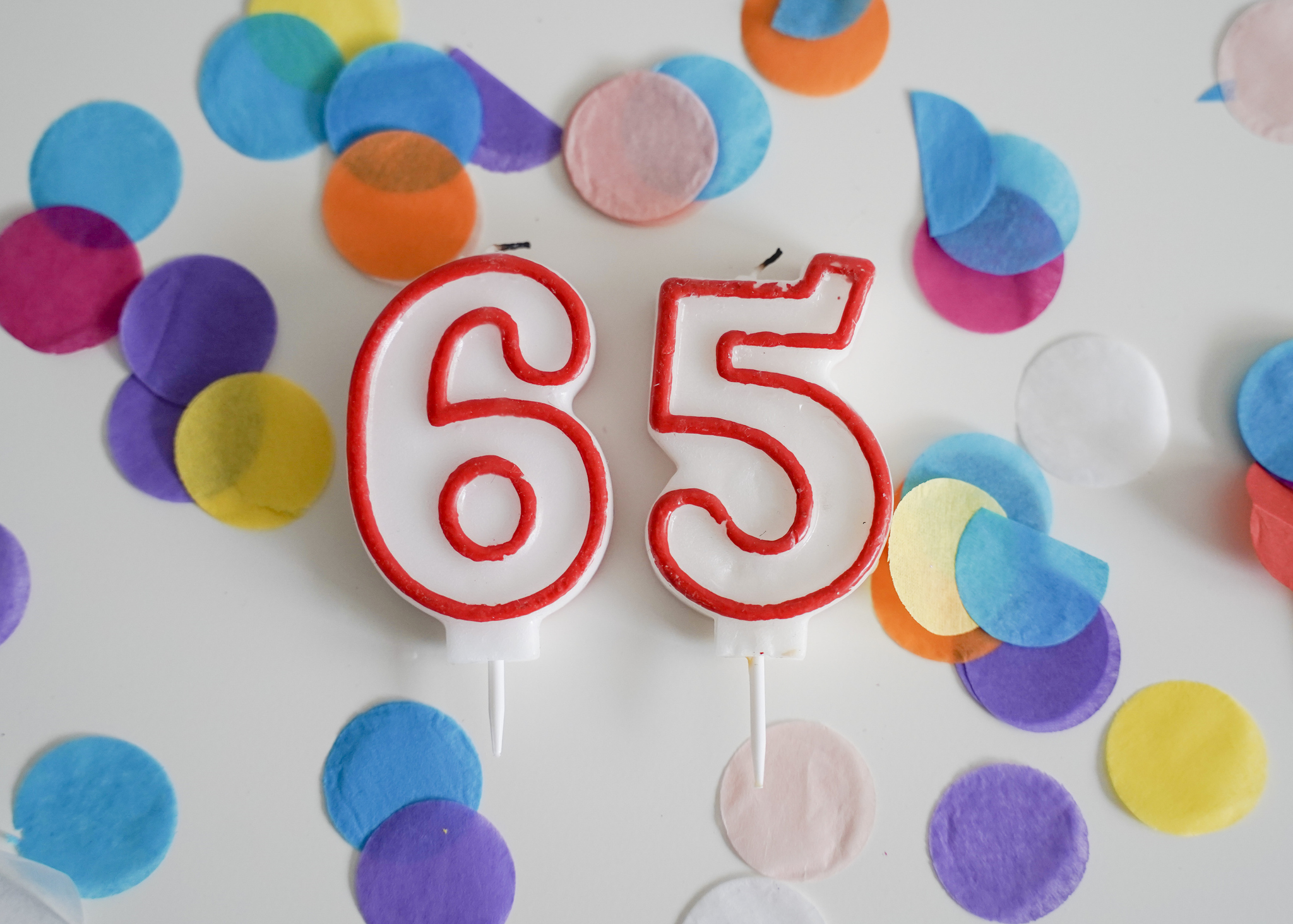 Birthday candle with colorful confetti -