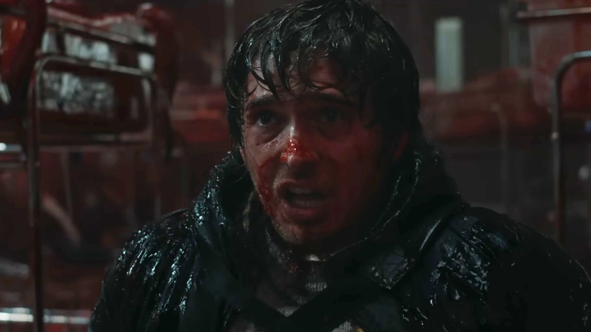 Austin Abrams covered in blood in Resident Evil.