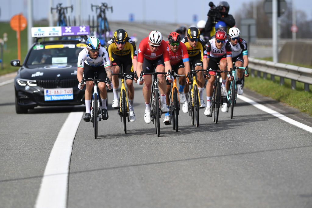 WEVELGEM BELGIUM MARCH 28 Giacomo Nizzolo of Italy and Team Qhubeka Assos Nathan Van Hooydonck of Belgium and Team Jumbo Visma Stefan Kung of Switzerland and Team Groupama FDJ Sonny Colbrelli of Italy and Team Bahrain Victorious Wout Van Aert of Belgium and Team Jumbo Visma Matteo Trentin of Italy and UAE Team Emirates Michael Matthews of Australia and Team Team BikeExchange during the 83rd GentWevelgem in Flanders Fields 2021 Mens Elite a 254km race from Ypres to Wevelgem Breakaway GWE21 GWEmen FlandersClassic on March 28 2021 in Wevelgem Belgium Photo by Tim de WaeleGetty Images