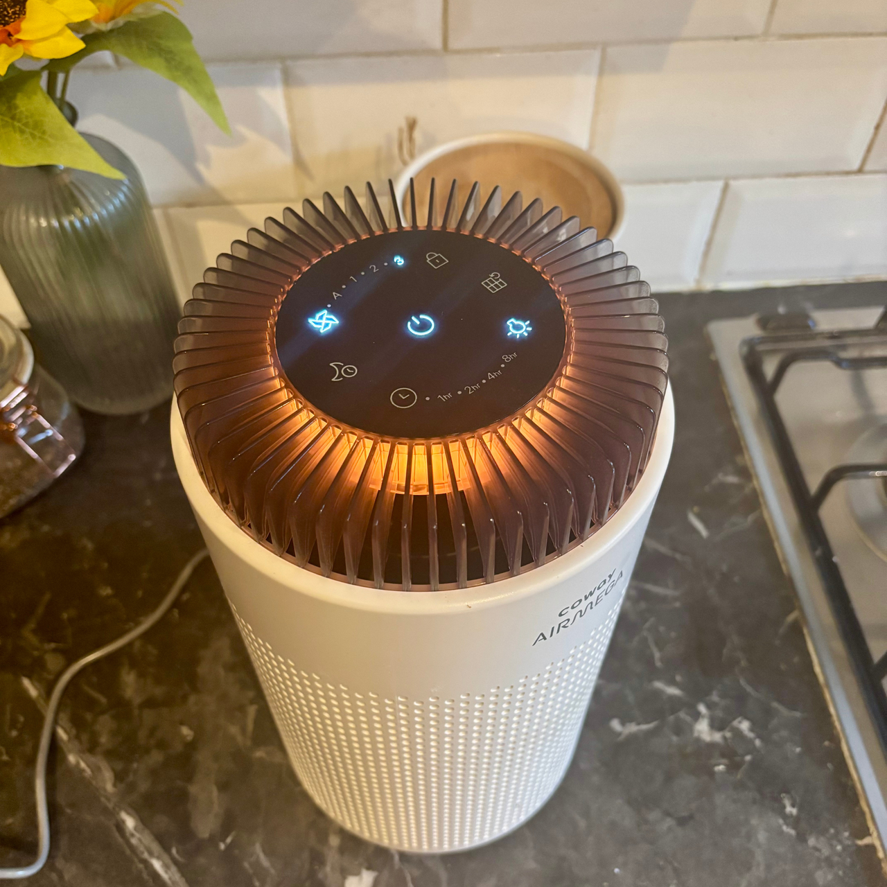 Coway Airmega 50 on kitchen worktop with orange light indicator