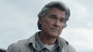 Kurt Russell's Lee Shaw looks out at something off-camera in Monarch: Legacy of Monsters