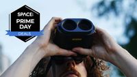 A man looking up through the Fujifilm Techno-Stabi TS-L 1640 image-stabilized binoculars with the sky in the background and a black Space.com Prime Day badge in the upper left corner.