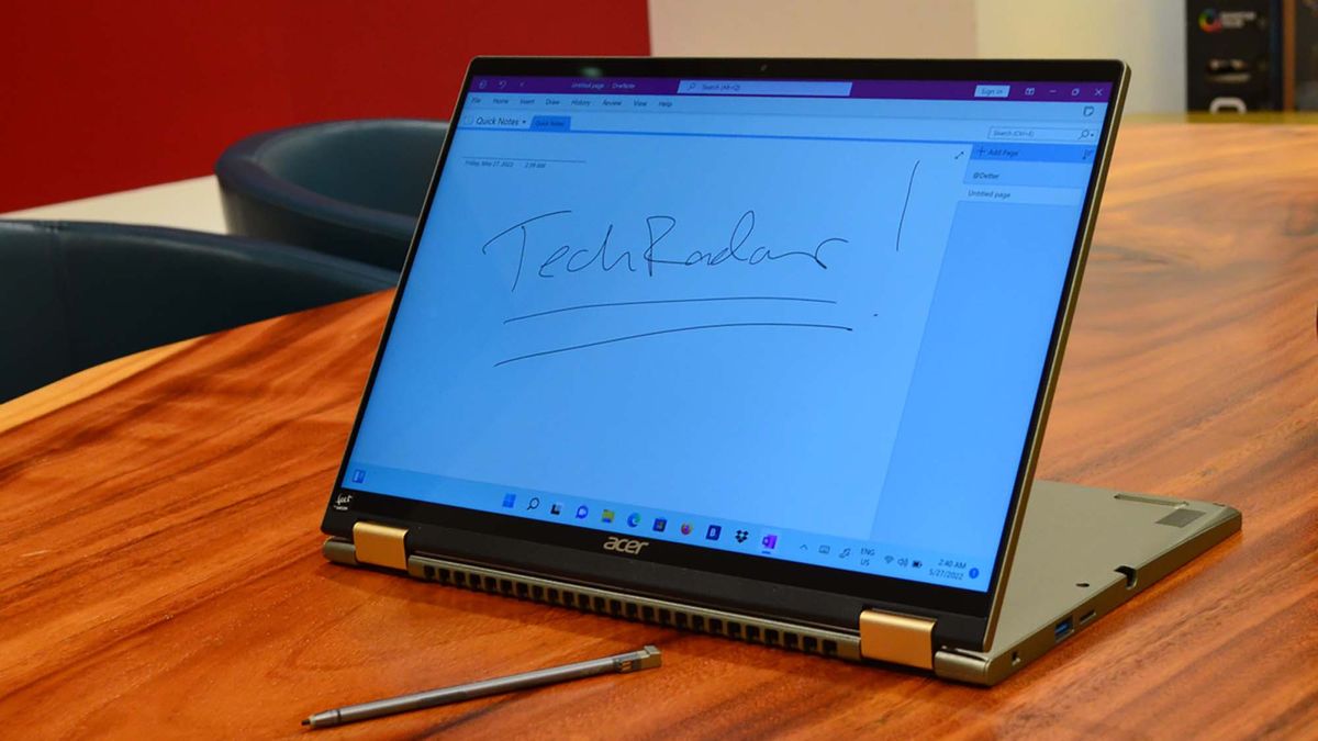 An Acer Spin 5 (2022) on a wood grain table