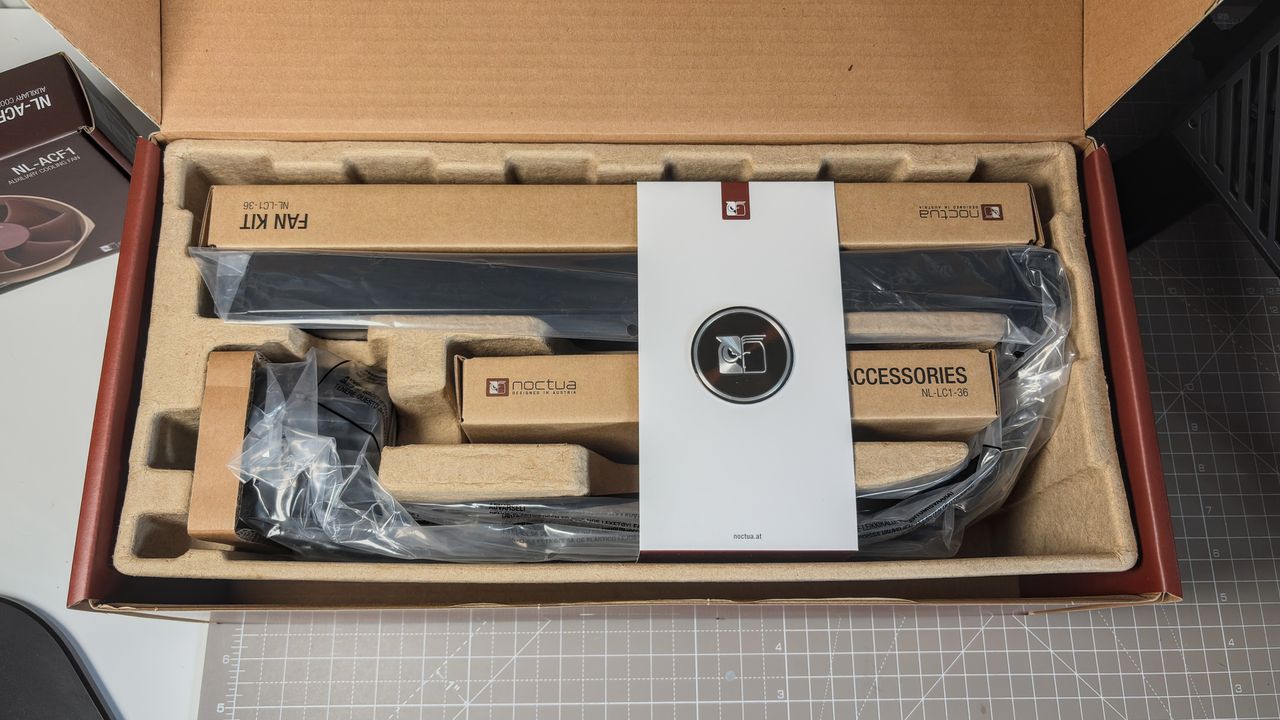 A Noctua NL-LC1 liquid cooler being installed on a test bench for testing.
