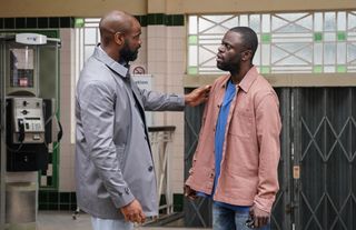 Junior Knight talking to Kojo Asare in the tube station