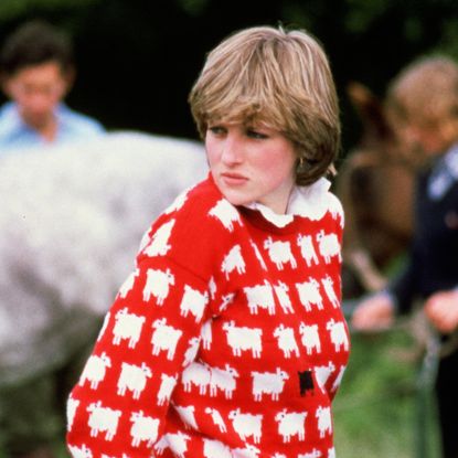Princess Diana wearing a red sheep sweater