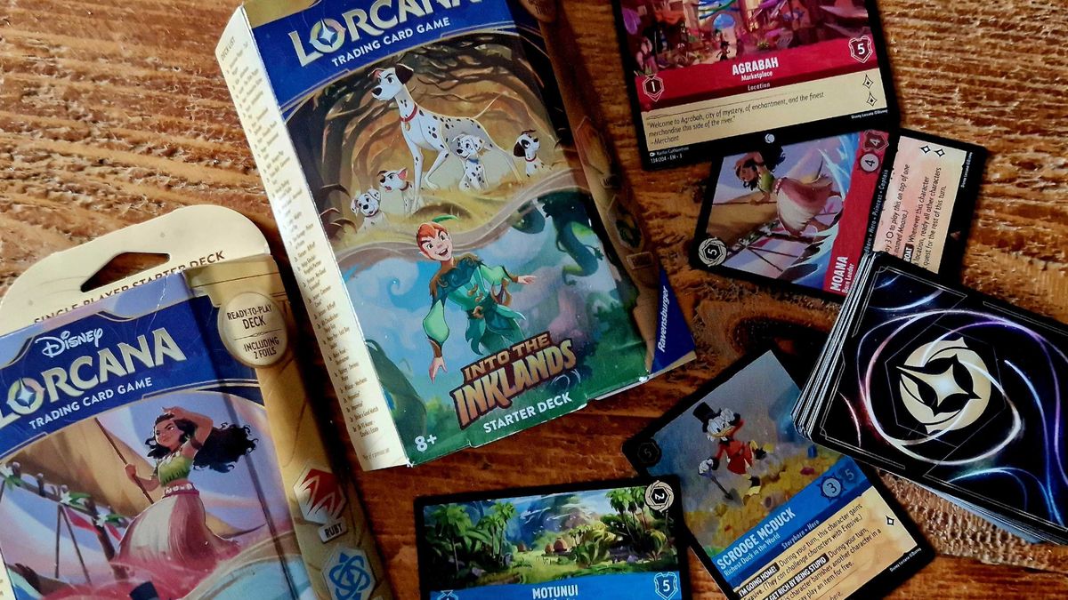 Disney Lorcana Into the Inklands boxes and cards on a wooden table