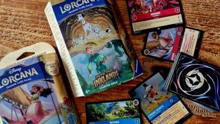 Disney Lorcana Into the Inklands boxes and cards on a wooden table