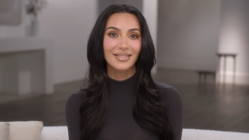 Kim Kardashian talking to camera in long sleeve black shirt in The Kardashians Season 7