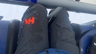 Wearing Helly Hansen ski pants on the chairlift