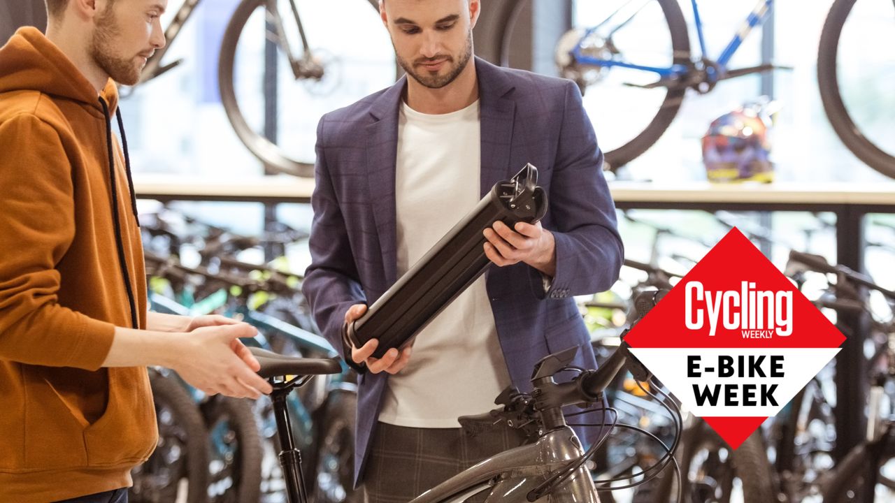 customer inspects an ebike battery 