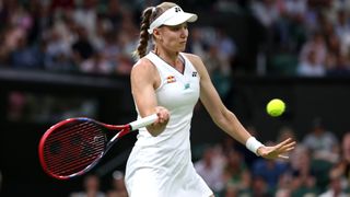 Elena Rybakina hits a forehand at Wimbledon