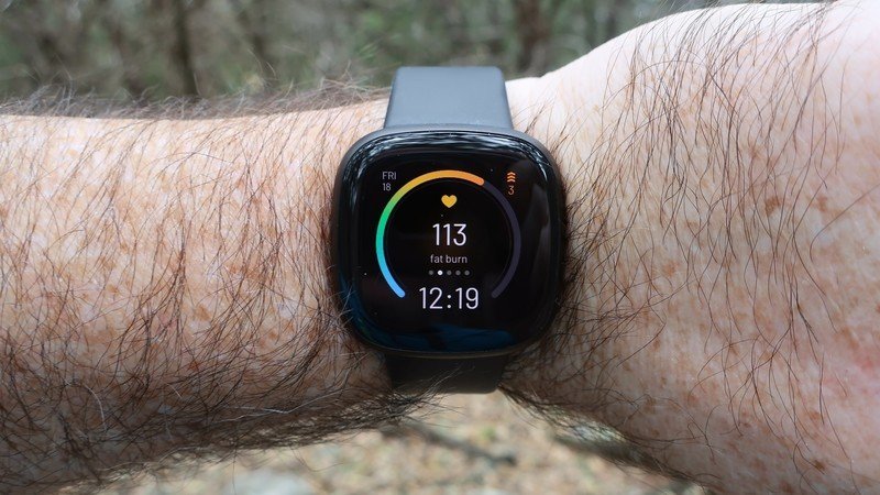 Fitbit Versa 3 on a wrist measuring heart rate